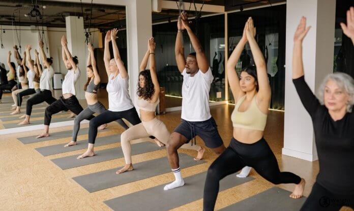 a photo of people practicing yoga