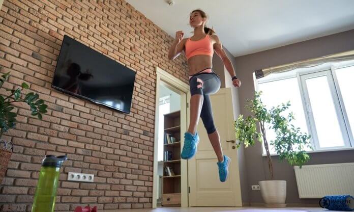 Woman doing cardio at home