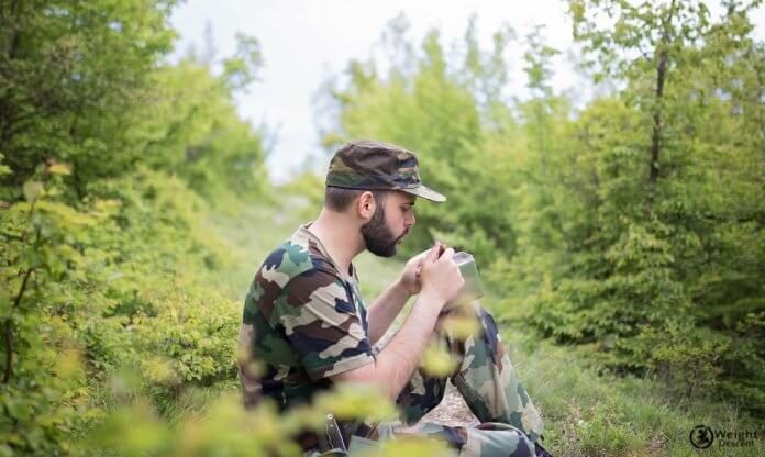 a photo of eating soldier in forrest