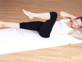 woman doing crunches at home