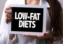 woman holding low fat diet sign