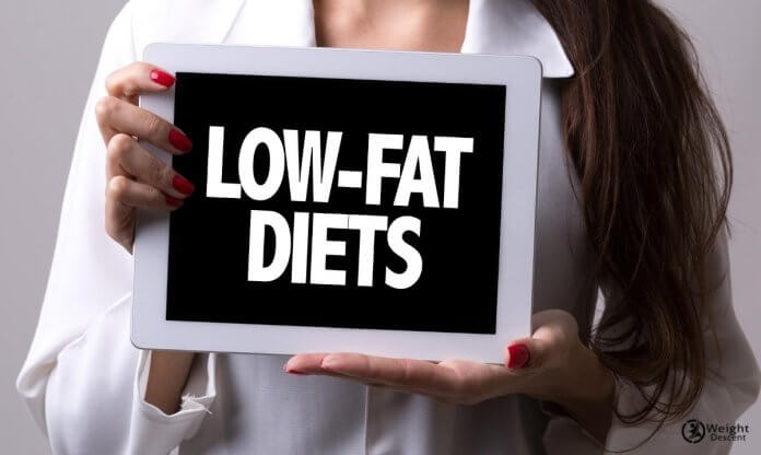 woman holding low fat diet sign