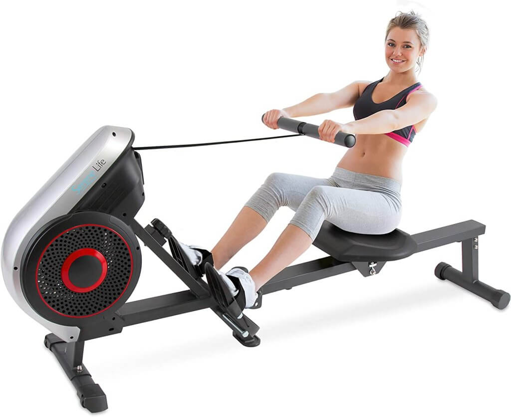 woman using SereneLife Rowing Machine